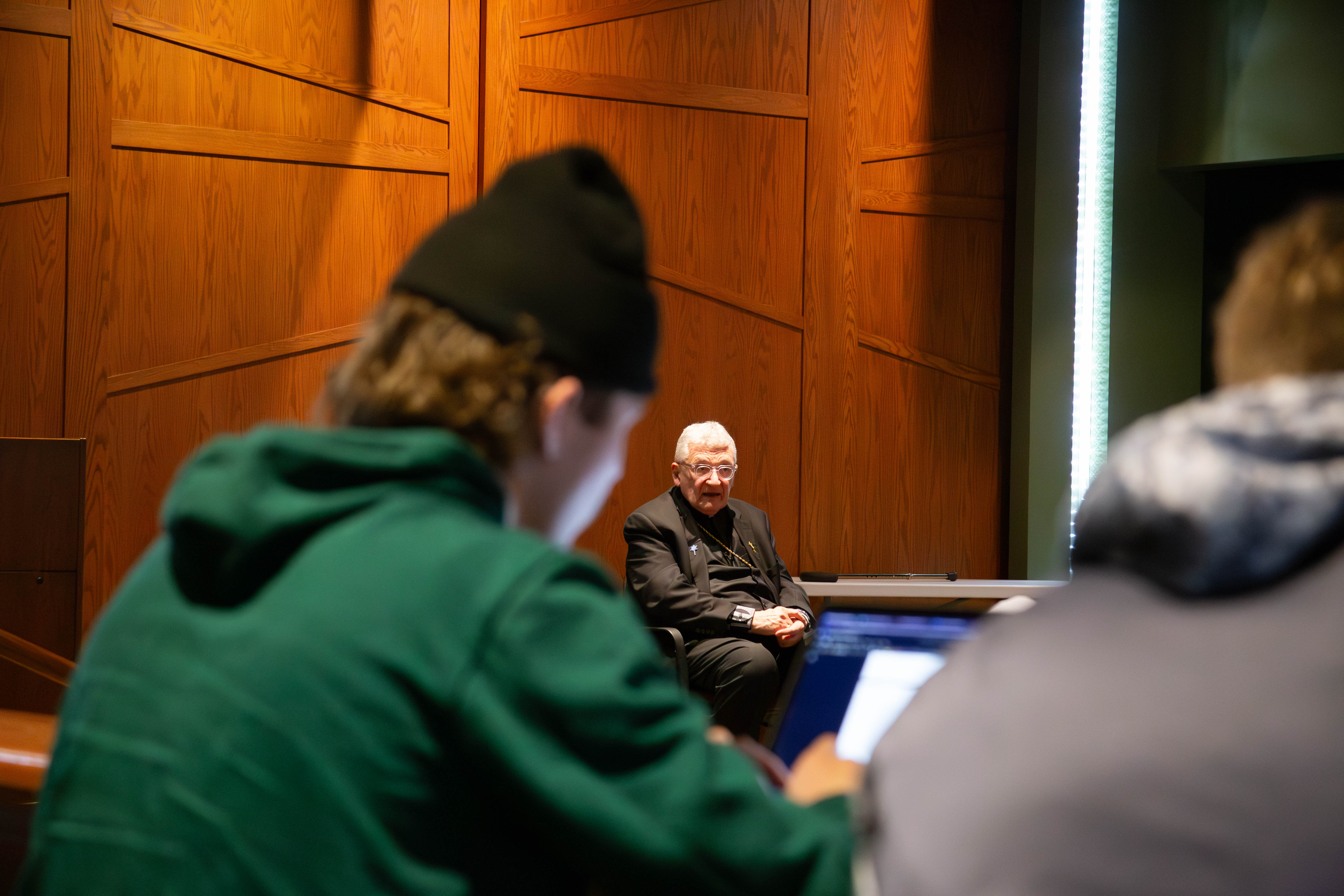 Bishop David Zubik of the Diocese of Pittsburgh answers a question April 25 during a mock press conference with Saint Vincent College students.