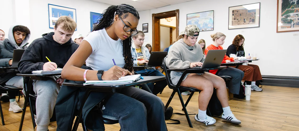 students take notes in a criminology class