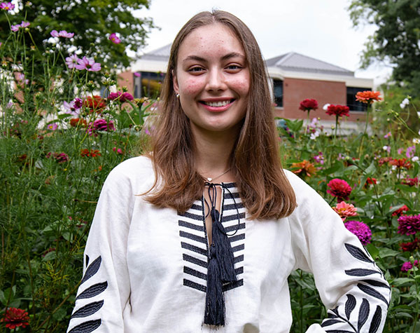 Student Photo Marta Trembestka outside with flowers in background