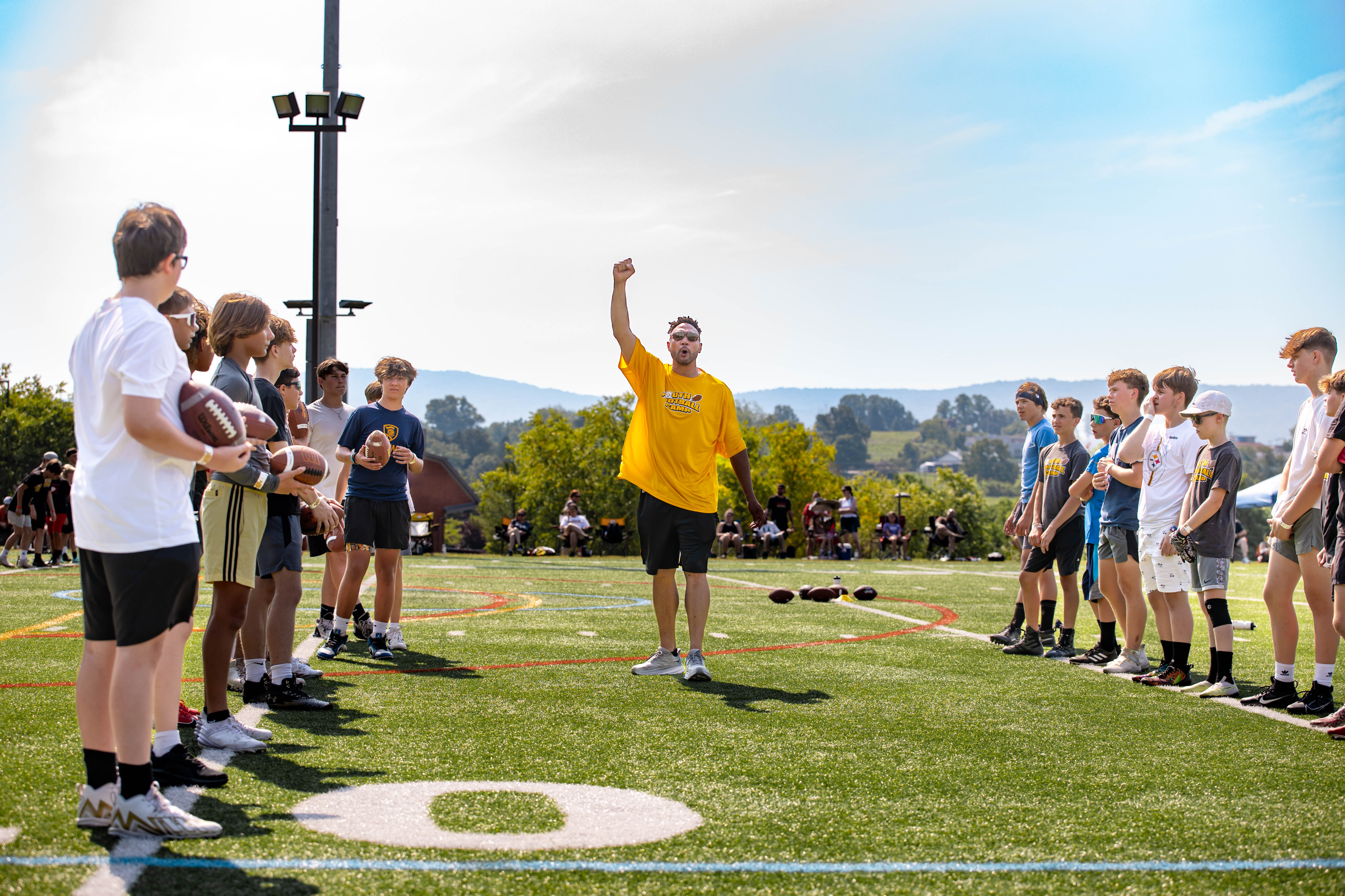 Former Steelers quarterback Charlie Batch leads a passing skills workout