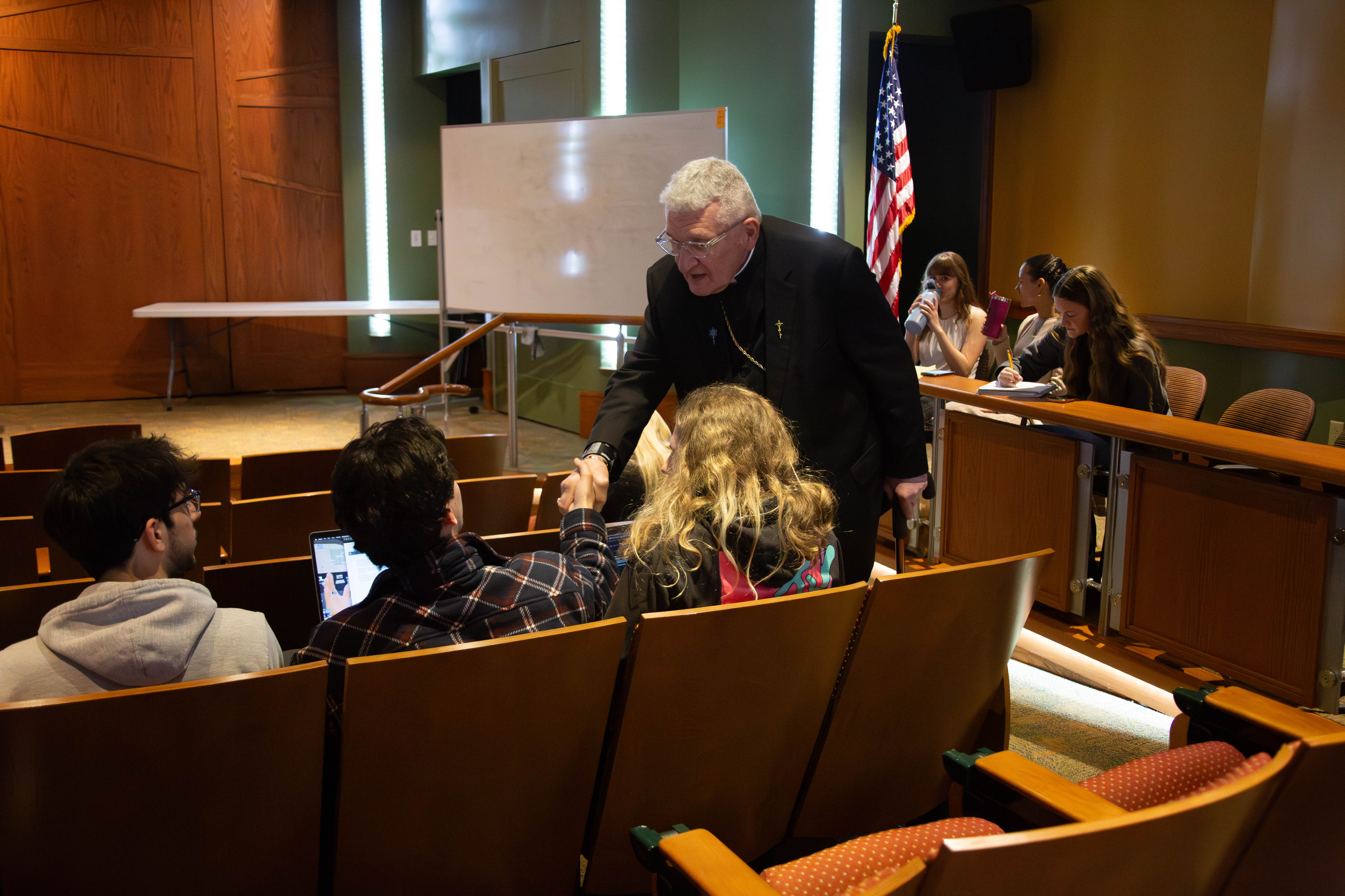 Bishop Zubik meets Saint Vincent College students April 25 before holding a mock press conference.
