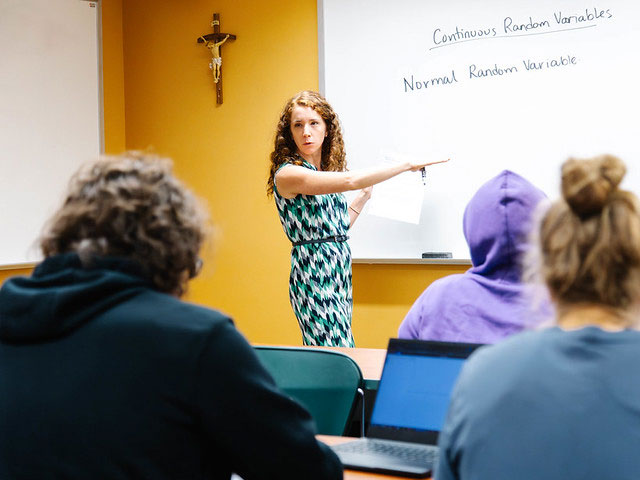 Dr. Sarah Dumnich, assistant professor of mathematics at Saint Vincent College, teaching a class.