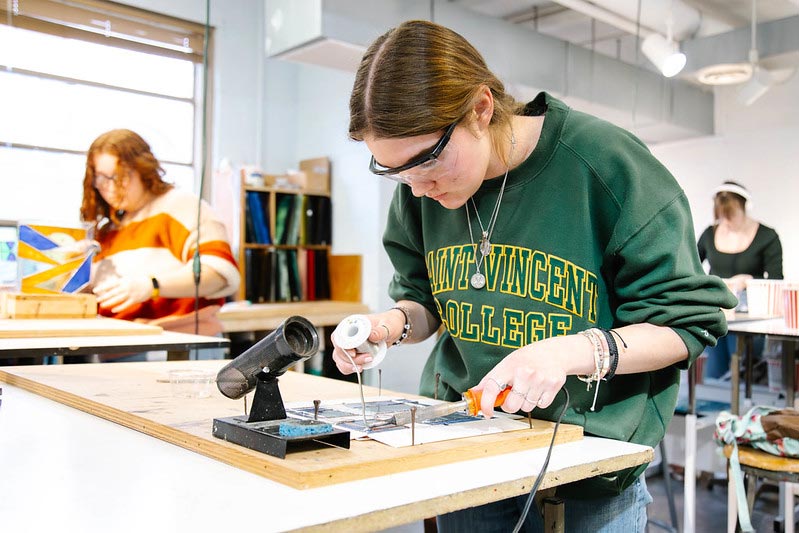 Saint Vincent College student in stained-glass class