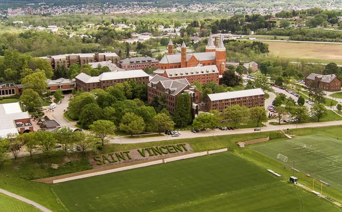 Aerial view of Saint Vincent College campus, showcasing its distinctive architecture and surrounding greenery.