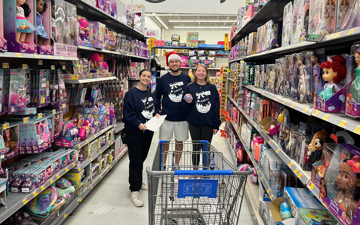 Saint Vincent College students shopping for SVC Wraps in the toy section of Walmart