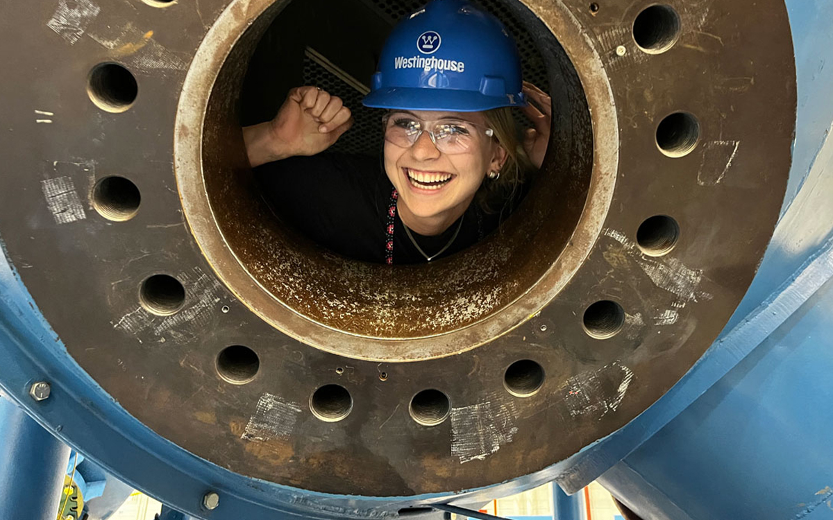 photo of Sydney Green inside a steam generator mockup at Westinghouse Electric